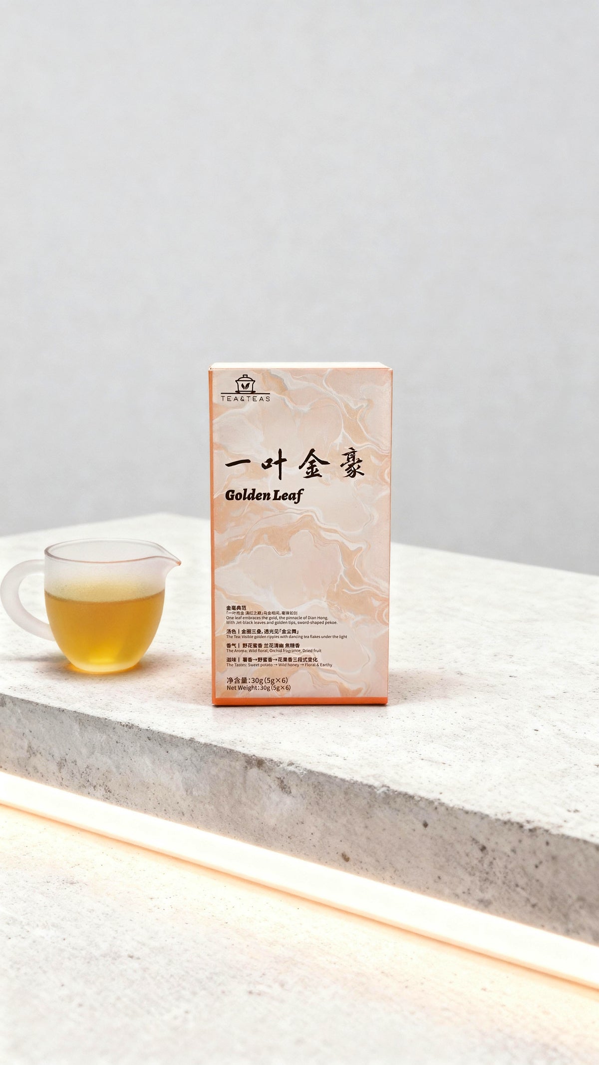 Tea packaging with a cup of tea on a light surface and gray background
